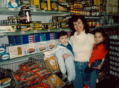 Woman with two children in front of a My Own Meals shelf display in 1988